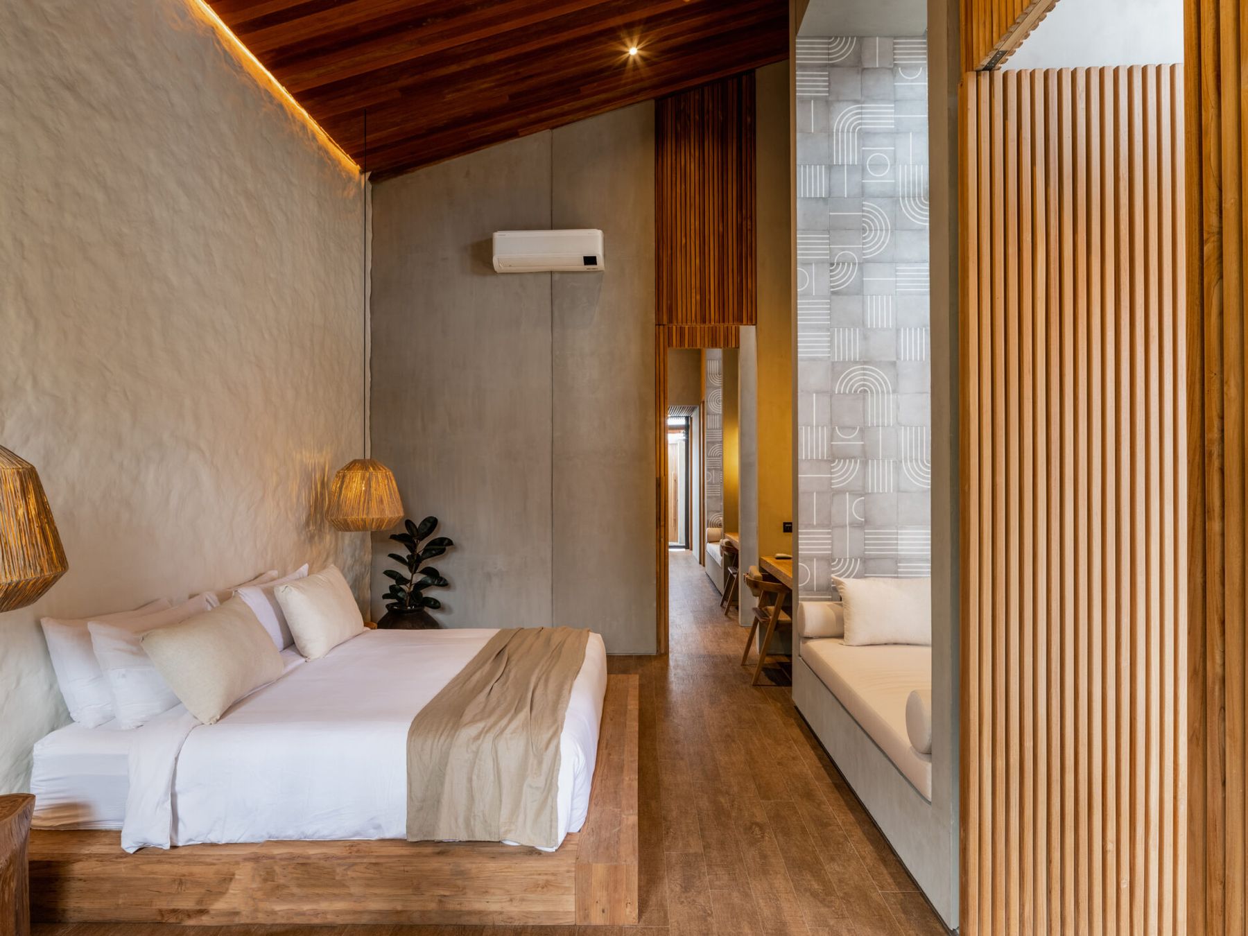 King bedroom with timber ceiling and garden light