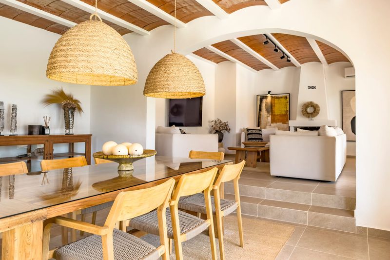 The long dining table, with the living room behind