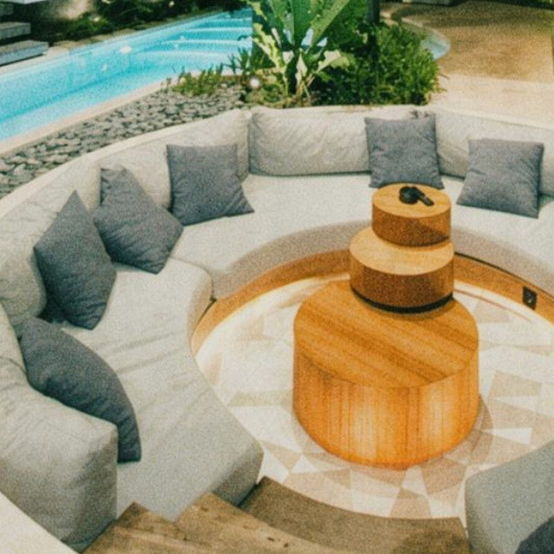 Sunken firepit lounge beside the villa pool