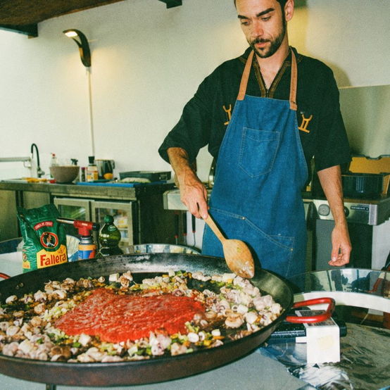 Private chef cooking a giant paella