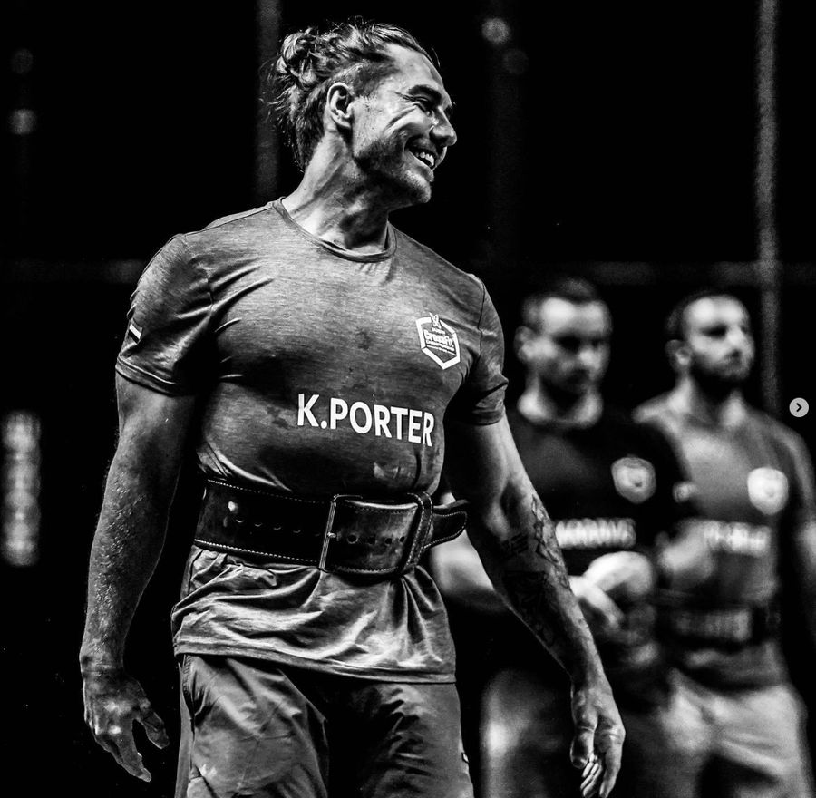 Khan Porter competing at a CrossFit event, photographed in black and white