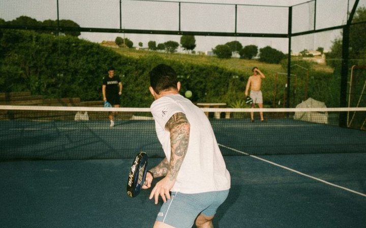 A padel game on an outdoor court